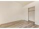The room has light wood-look floors and a closet with sliding doors at 10101 E Posada Ave, Mesa, AZ 85212