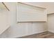 Walk-in closet featuring shelving and wooden rods for ample storage at 10101 E Posada Ave, Mesa, AZ 85212