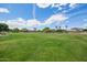 Expansive green common area enhances the community's appeal and provides a lush, open space for recreation at 10101 E Posada Ave, Mesa, AZ 85212