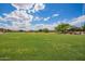 Expansive community green space offers a beautiful common area for residents to relax and enjoy the outdoors at 10101 E Posada Ave, Mesa, AZ 85212