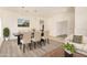 Bright dining room features modern furniture, stylish lighting, and neutral tones at 10101 E Posada Ave, Mesa, AZ 85212
