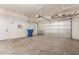 Spacious two-car garage with ample storage shelving and convenient access to the home at 10101 E Posada Ave, Mesa, AZ 85212