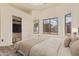 Spacious bedroom featuring a large closet and luxury vinyl flooring at 10101 E Posada Ave, Mesa, AZ 85212