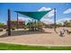 Community playground with shade structure offers a fun and safe environment for children to play and socialize outdoors at 10101 E Posada Ave, Mesa, AZ 85212