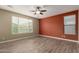 Comfortable bedroom with wood-look flooring and plenty of natural light from two windows at 12121 W Patrick Ln, Sun City, AZ 85373