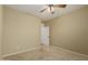 Well-lit bedroom with plush carpeting and a ceiling fan, offering comfort and style at 12121 W Patrick Ln, Sun City, AZ 85373