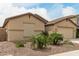Well-kept single-story house boasts a two-car garage and easy desert-style landscaping at 12121 W Patrick Ln, Sun City, AZ 85373