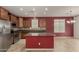 Well-equipped kitchen featuring granite countertops, stainless steel appliances, and ample cabinet space at 12121 W Patrick Ln, Sun City, AZ 85373