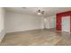Open living room with hardwood floors and neutral paint, perfect for relaxing or entertaining at 12121 W Patrick Ln, Sun City, AZ 85373