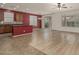 Bright living area with a seamless transition to the patio through sliding glass doors, showcasing an open layout at 12121 W Patrick Ln, Sun City, AZ 85373