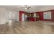Open-concept living room featuring a kitchen with stainless steel appliances and a stylish island at 12121 W Patrick Ln, Sun City, AZ 85373