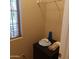 Convenient laundry area with shelving and a small refrigerator at 15350 W Skyview Way, Surprise, AZ 85374