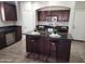 Modern kitchen with dark wood cabinets and granite countertops at 2946 E Quiet Hollow Ln, Phoenix, AZ 85024