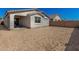 Large, blank backyard space with a covered patio, ready to create your outdoor oasis in this new home at 5419 W Las Palmaritas Dr, Glendale, AZ 85302