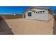 Spacious blank backyard area with privacy wall, offering endless possibilities for landscaping and outdoor living at 5419 W Las Palmaritas Dr, Glendale, AZ 85302