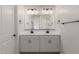 Bathroom featuring double sinks, quartz countertop and black hardware at 5419 W Las Palmaritas Dr, Glendale, AZ 85302
