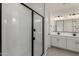 Bright bathroom features white subway tile shower with black trim at 5419 W Las Palmaritas Dr, Glendale, AZ 85302