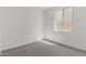 Bright, carpeted bedroom features a large window and ample natural light at 5419 W Las Palmaritas Dr, Glendale, AZ 85302