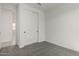 Neutral bedroom featuring plush carpeting and a closet with double doors at 5419 W Las Palmaritas Dr, Glendale, AZ 85302