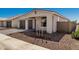 Beautiful exterior view of a modern home with a gray garage, a paved driveway, and manicured landscaping at 5419 W Las Palmaritas Dr, Glendale, AZ 85302