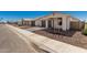 Attractive street view of a new build featuring a paved driveway, desert landscaping, and modern home design at 5419 W Las Palmaritas Dr, Glendale, AZ 85302
