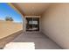 Covered back patio with a sliding glass door leading to the home's interior at 5419 W Las Palmaritas Dr, Glendale, AZ 85302