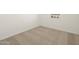 Empty bedroom with neutral colored carpet at 9115 N 173Rd Ln, Waddell, AZ 85355