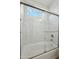 Modern bathroom featuring white tiles and a glass shower showcasing bright natural light at 13634 S 192Nd Ave, Buckeye, AZ 85326
