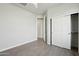 Bedroom with wood-look flooring, closet with sliding doors, and an interior door frame at 13634 S 192Nd Ave, Buckeye, AZ 85326