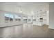 Bright open space, featuring a well-lit kitchen with a center island and desert views from the living room at 13634 S 192Nd Ave, Buckeye, AZ 85326