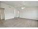 Large, open living room with light-colored walls and tile floors, offering ample space at 13634 S 192Nd Ave, Buckeye, AZ 85326