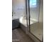 Bathroom with tub and shower featuring a glass surround at 141 N Pasadena --, Mesa, AZ 85201