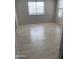 Light-filled bedroom with neutral walls, wood-look floors, and natural light at 141 N Pasadena --, Mesa, AZ 85201