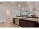 Spacious open kitchen with granite countertops and views to the living area at 16468 W Mariposa Grande --, Surprise, AZ 85387