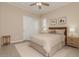 Well-lit bedroom with a neutral color scheme, a ceiling fan, and ample closet space at 21774 E Camacho Rd, Queen Creek, AZ 85142