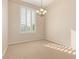 Bright dining room with shuttered window and chandelier, perfect for gatherings at 21774 E Camacho Rd, Queen Creek, AZ 85142