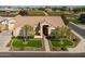Attractive single-story home featuring manicured lawns, trees, and a tile roof at 21774 E Camacho Rd, Queen Creek, AZ 85142