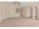 Open-plan living area featuring neutral colors and versatile layout at 21774 E Camacho Rd, Queen Creek, AZ 85142