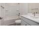 Bathroom with tub and shower combo, a single sink, and modern fixtures at 5649 N 205Th Ln, Buckeye, AZ 85396