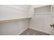 Walk-in closet with rod and shelf, ready for organization at 5649 N 205Th Ln, Buckeye, AZ 85396