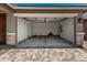 Spacious garage with epoxy floors, insulated doors, and ample storage at 5649 N 205Th Ln, Buckeye, AZ 85396