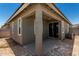 Covered patio area with sliding glass doors at 5649 N 205Th Ln, Buckeye, AZ 85396
