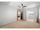 Spacious bedroom featuring neutral walls, carpet, and doorways to living spaces at 7979 E Princess Dr # 13, Scottsdale, AZ 85255