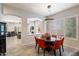 Open-concept dining area featuring a round table, stylish chairs, and a view of the living room at 7979 E Princess Dr # 13, Scottsdale, AZ 85255