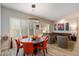 Elegant dining area with modern lighting, stylish chairs, and seamless access to the living room at 7979 E Princess Dr # 13, Scottsdale, AZ 85255