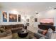 Cozy living room with a comfortable sectional sofa, stylish rug, and decorative wall art at 7979 E Princess Dr # 13, Scottsdale, AZ 85255