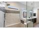 An updated shower with a built-in seat and luxurious tile surround at 7979 E Princess Dr # 13, Scottsdale, AZ 85255