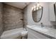 Bathroom with a tub, granite vanity top, and updated vanity lighting at 9346 E Citrus N Ln, Sun Lakes, AZ 85248