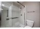 Bathroom featuring a glass enclosed shower with metal fixtures and a toilet at 9346 E Citrus N Ln, Sun Lakes, AZ 85248