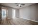 Bright bedroom with fan, light gray walls, hard floors, and white trim at 9346 E Citrus N Ln, Sun Lakes, AZ 85248